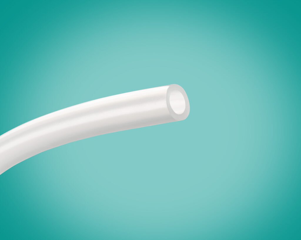 Single piece of APAF tube on a teal background