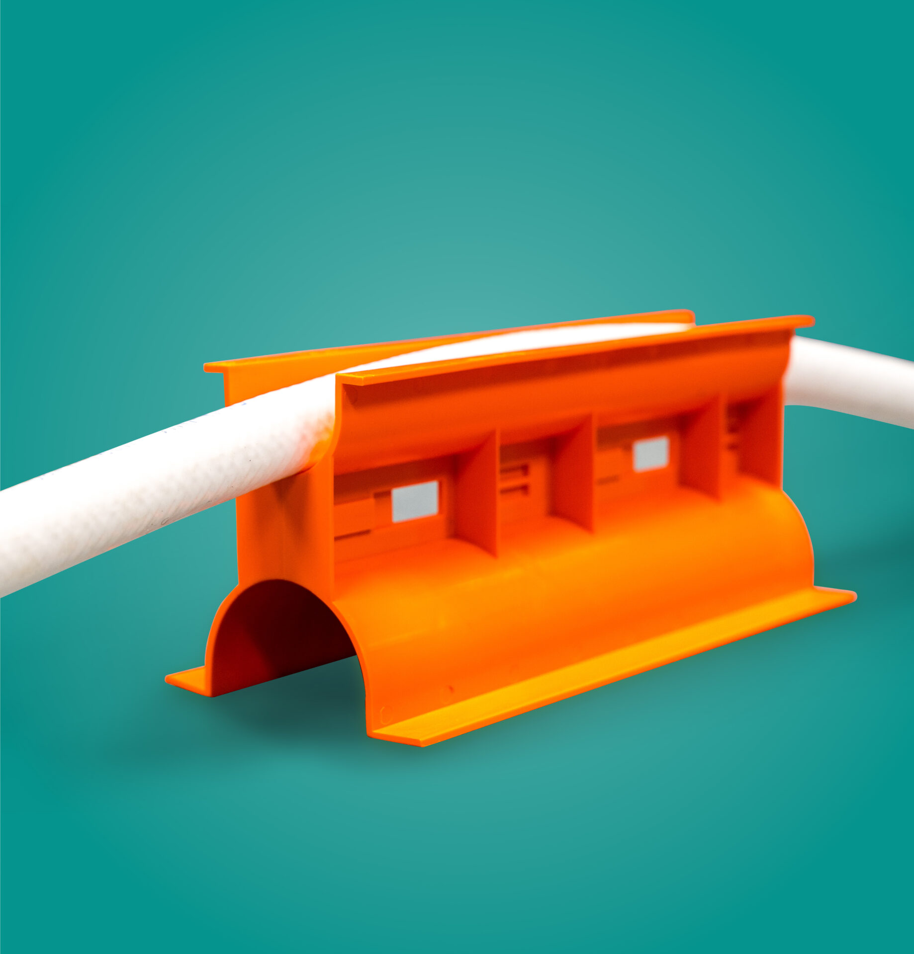 Orange Hose Holder holding up Tubing on a teal background